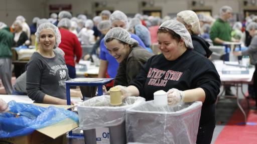 North Central College students packing meals at a Feed the Need event.